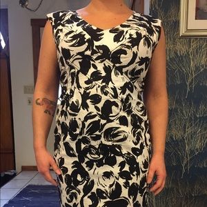 Black and white form fitting lace back dress